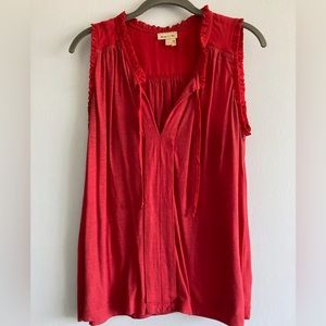 Red sleeveless blouse